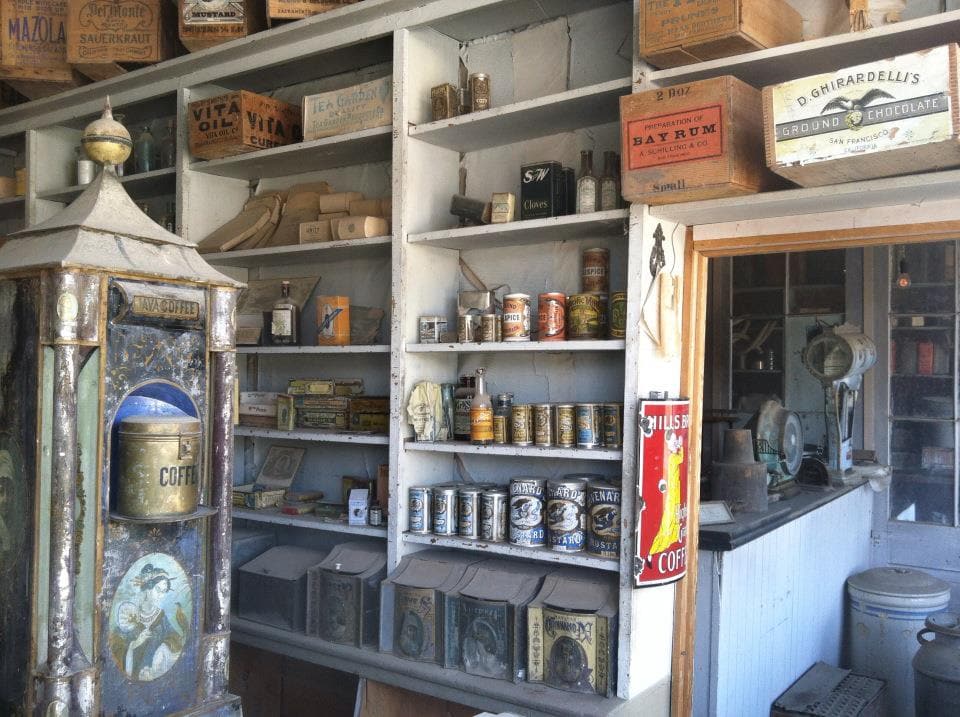 Vintage antique soda fountain shop with historical coffee and canned goods collection.