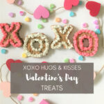 Colorful Valentine's Day treats decorated with frosting and sprinkles, spelling out "XOXO", perfect for romantic celebrations.