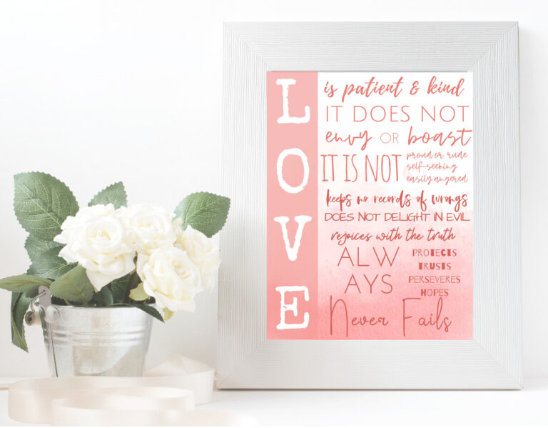 love is patient and kind wall art, pink ombre, in white frame with potted flowers