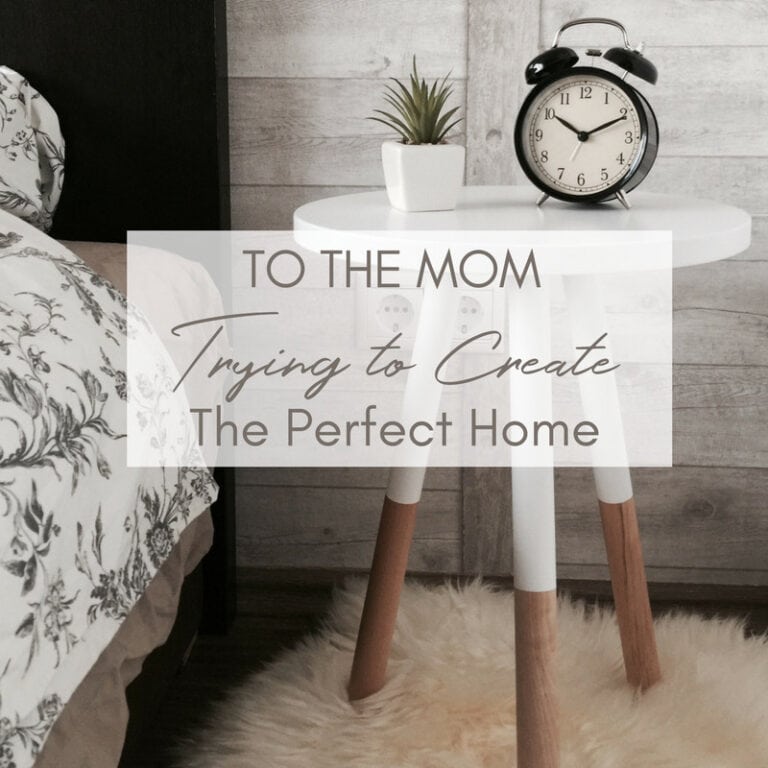 Rustic modern bedroom decor with a cozy side table and alarm clock, perfect for creating a welcoming home environment.