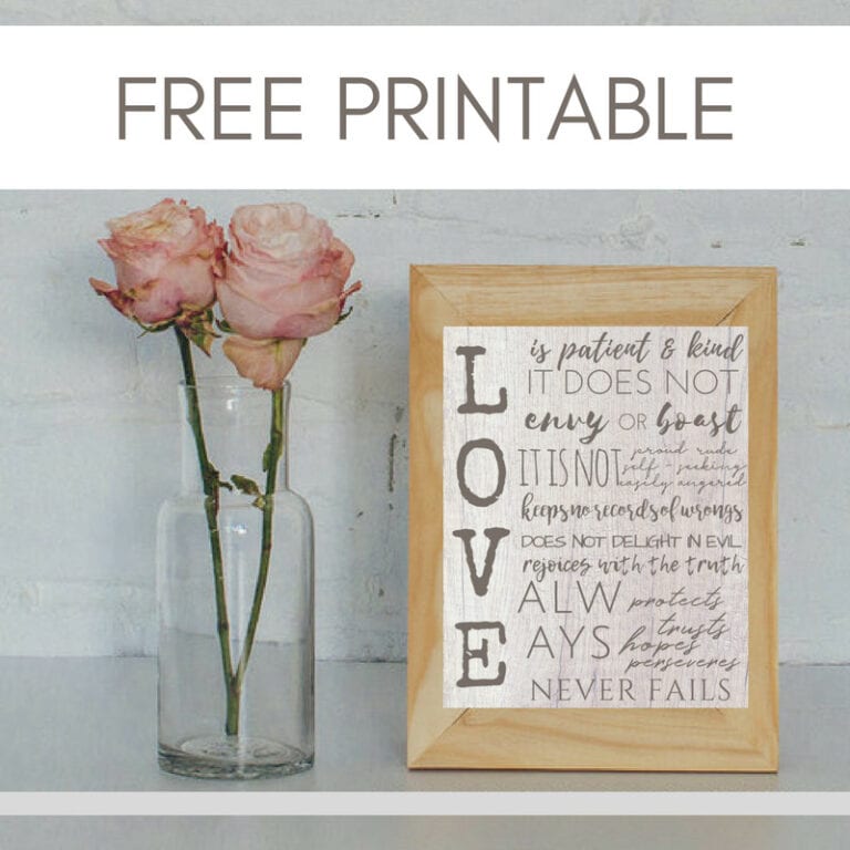 Beautiful pink roses in clear glass vase next to framed love quote art, natural minimalist decor, perfect for home, bedroom, or living room inspiration, positive message.