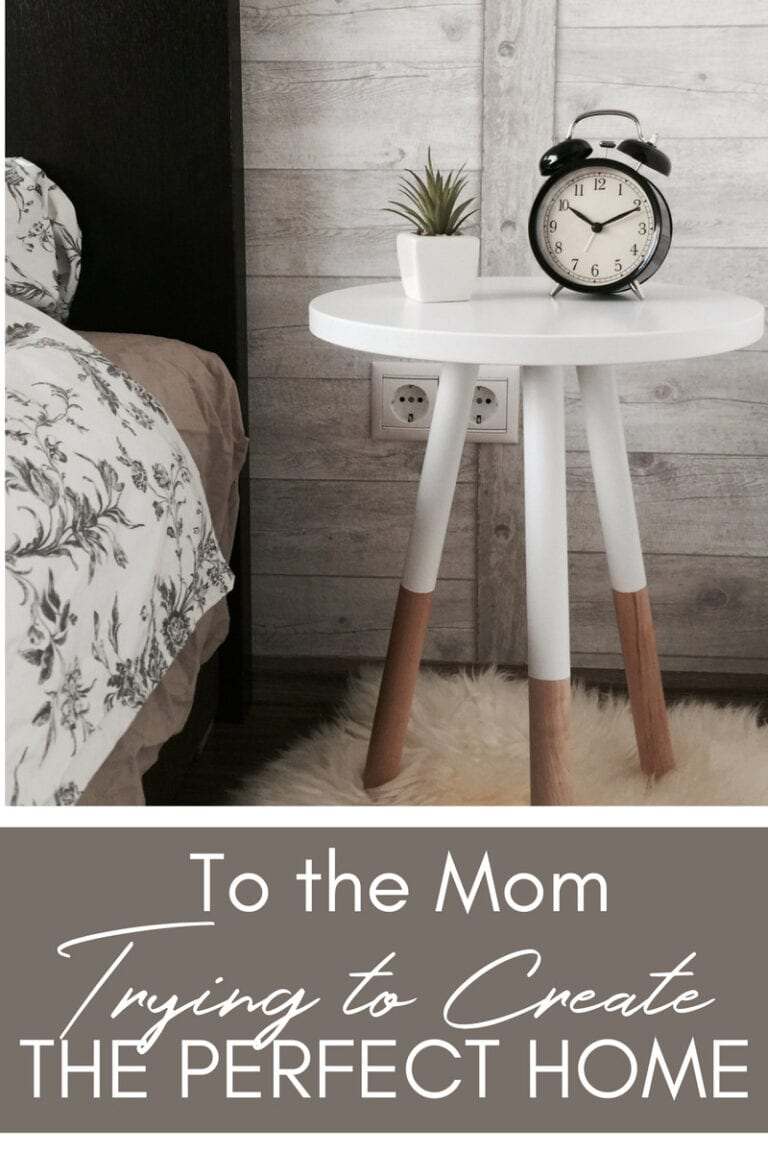 Simple modern white bedside table with wooden legs, black alarm clock, potted plant, and rustic wood panel wall, cozy bedroom decor, perfect home interior, aesthetic wall art.