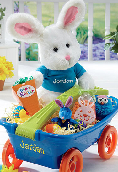 Colorful Easter bunny plush toy with personalized name Jordan, surrounded by festive eggs and decorations in a toy wagon, ideal for Easter gifts for kids.
