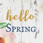 Colorful spring floral welcome sign with wood background, perfect for spring decor, garden parties, or seasonal home accents.