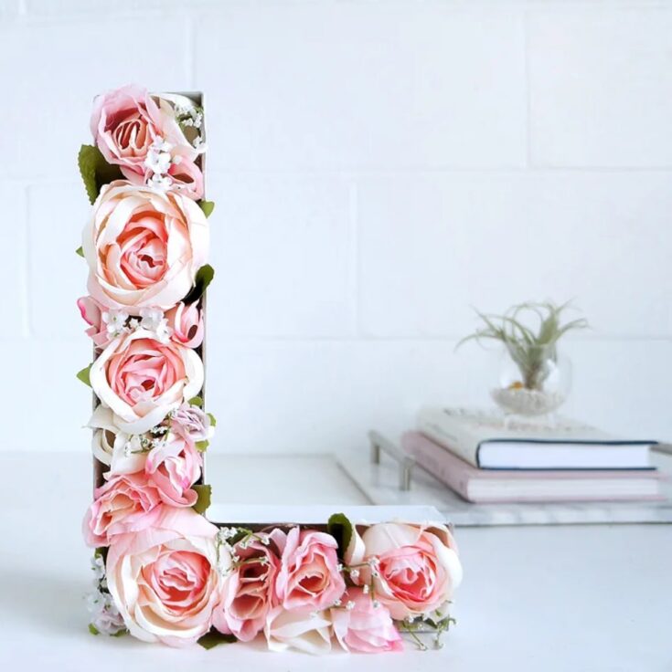 Beautiful pink and white roses arranged in the shape of the letter "L" for wall decor or gifts.
