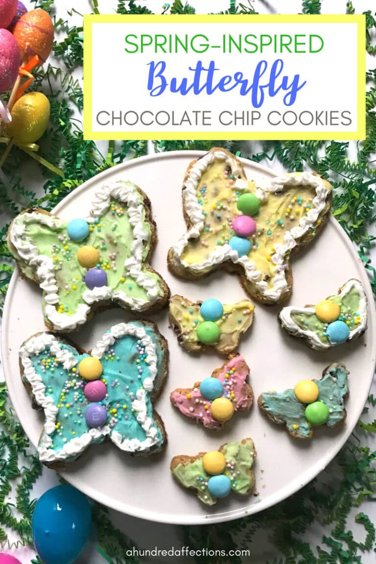 Colorful spring-inspired butterfly chocolate chip cookies decorated with pastel icing, sprinkles, and candy eggs on a white plate for Easter treats and spring celebrations.