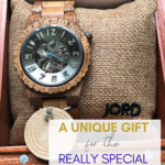 Handsome young boy holding an adult's arm, emphasizing meaningful gift for special people, with a Jord watch, in a heartfelt appreciation for loved ones.