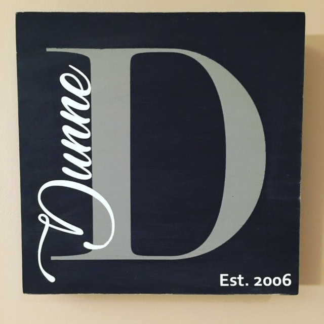Handmade wall decor with a large letter D, personalized with the name "Juelle" and the establishment year 2006, perfect for home or office interior design.
