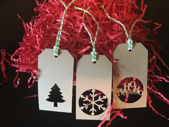 Festive holiday gift tags with Christmas tree, snowflake, and holiday message designs, perfect for seasonal gift wrapping and festive decorations.