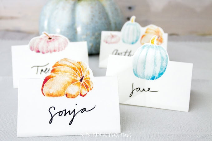 Colorful watercolor pumpkin place cards for fall weddings and events at A Hundred Affections.