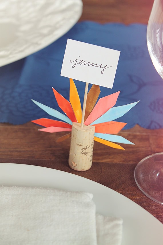 Colorful DIY place card holder with "Jenny" name tag for wedding or event table setting.
