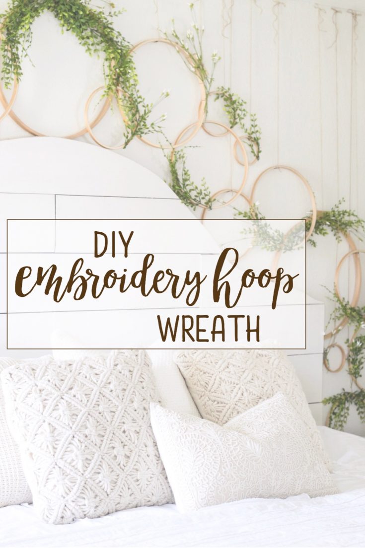Embroidery hoop wreaths linked together as wall decor above bed