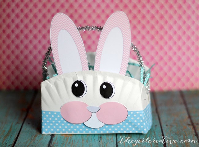 Colorful Easter Bunny-themed basket with polka dot design and bunny ears for kids' Easter egg hunt and celebrations.