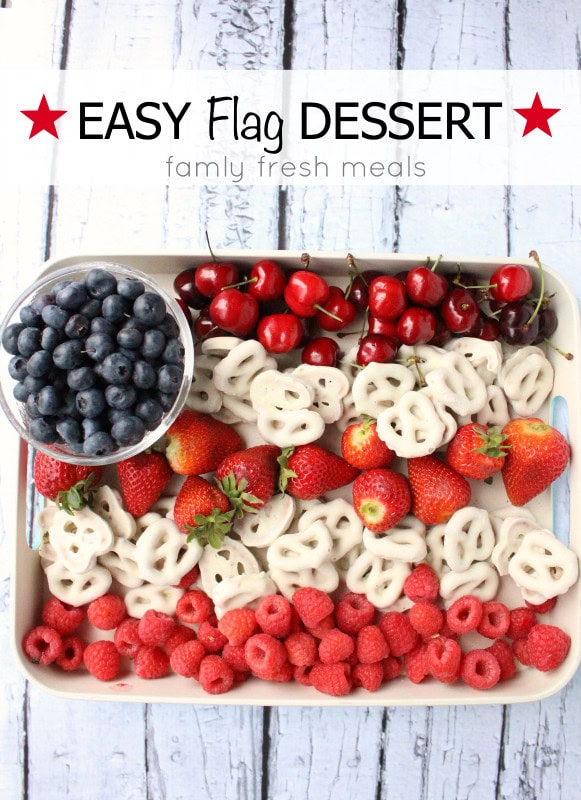 Fresh fruit dessert platter with blueberries, strawberries, cherries, raspberries, and pretzels for family-friendly meals.