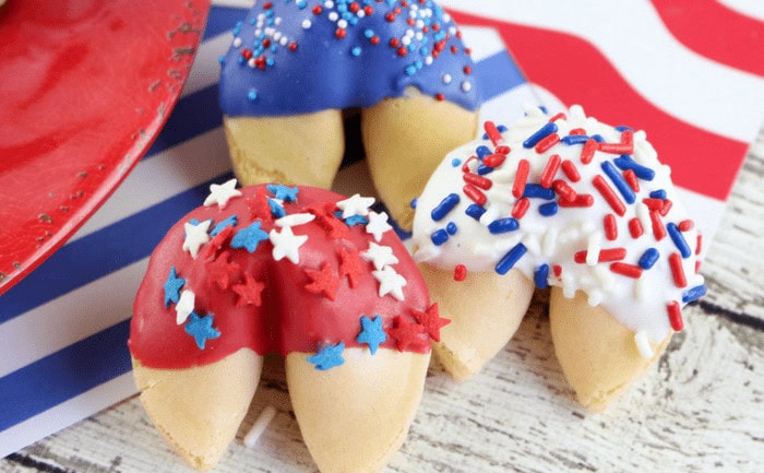 Colorful patriotic cake cookies decorated with red, white, and blue sprinkles, perfect for American holidays or celebrations.