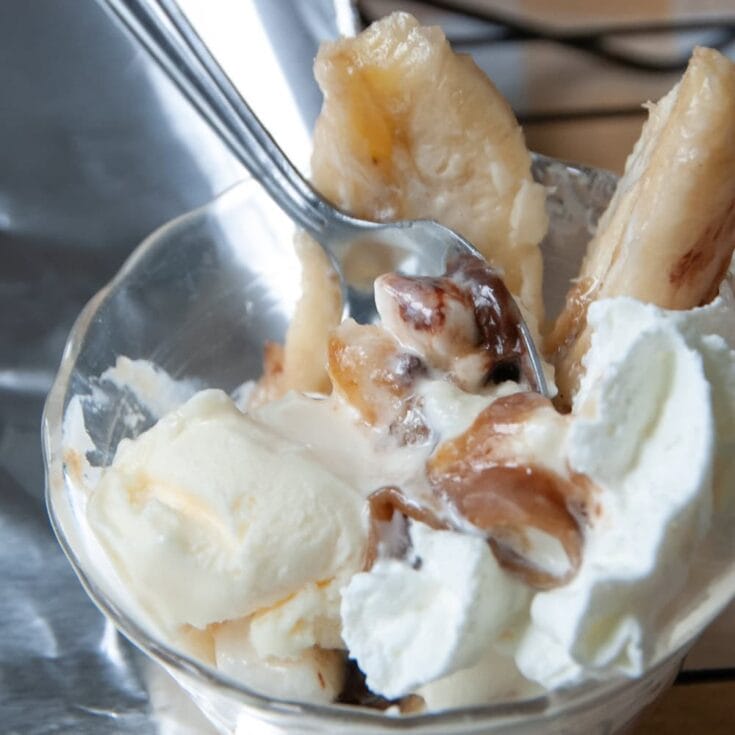 Creamy vanilla ice cream with ripe bananas and caramel sauce, served in a glass bowl. Perfect dessert for banana lovers and caramel fans.