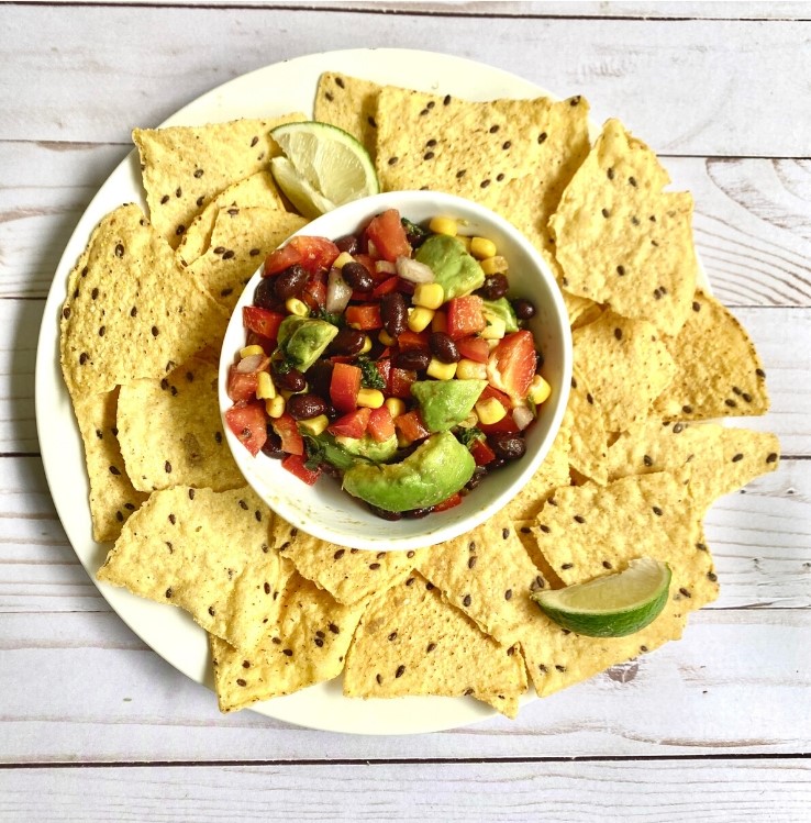 cowboy caviar plated with chips and lime, top view