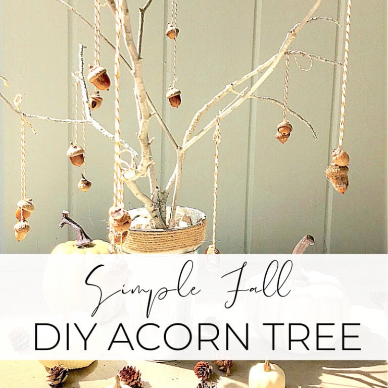 Brown acorn tree decorations hanging from twigs in a pot for fall DIY craft project, autumn-themed home decor ideas, simple fall acorn craft for Thanksgiving, seasonal natural decorations, autumn DIY acorn tree display.