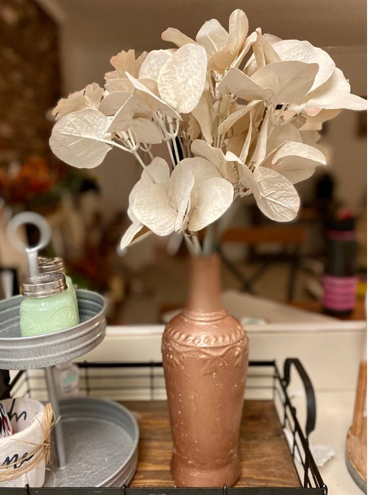 White hydrangea flowers in a rustic brown vase, decorative floral arrangement for home decor, aesthetic floral centerpiece, elegant indoor flower display, garden-inspired decor element.