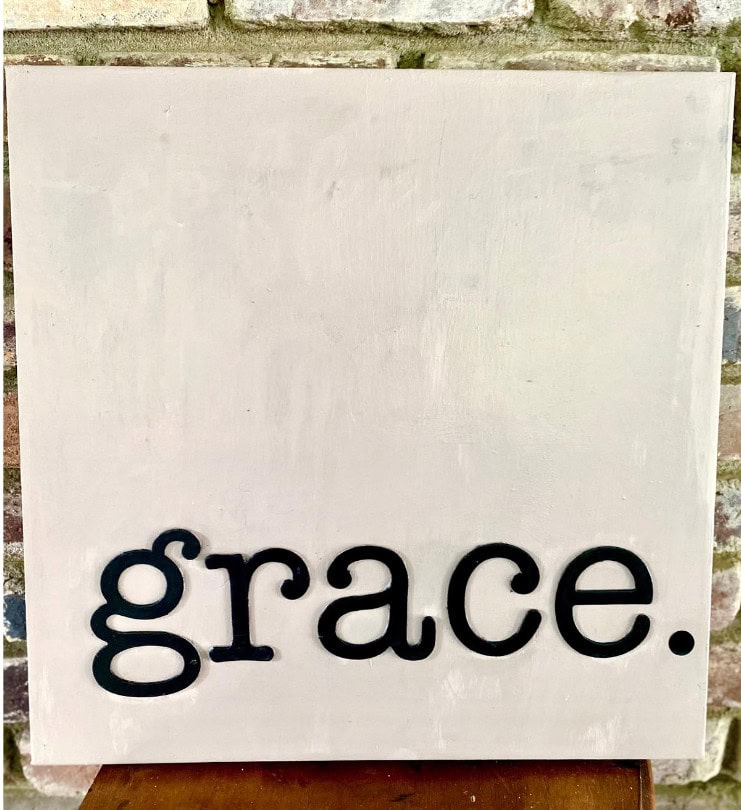 Grace wooden sign with black lowercase letters on distressed white background, minimalist home decor, inspirational quote, modern rustic wall art, positive affirmation for home interior design, A Hundred Affections.