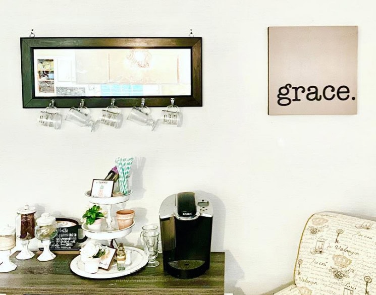Cozy coffee corner with a Nespresso machine, decorative jars, and a "grace" wall art, perfect for enjoying morning coffee at A Hundred Affections.