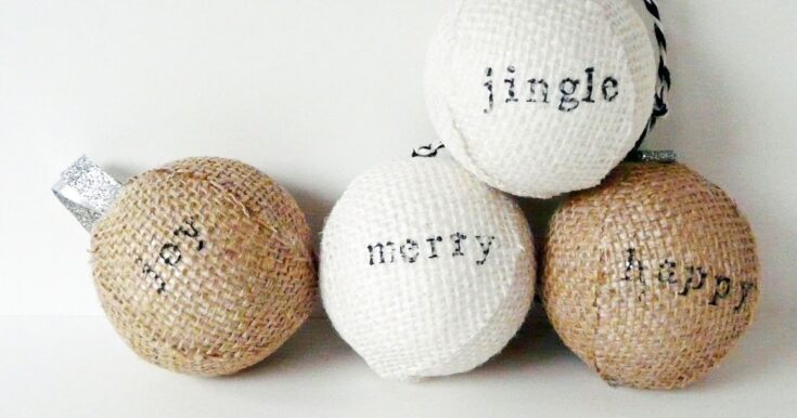 Soft rustic Christmas ornaments with burlap texture and handwritten words like "joy" and "merry" for warm holiday decor.