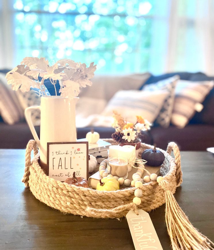 Fall decor with a cozy centerpiece on a dark wooden table, featuring pumpkins, candles, and autumn-themed accessories, perfect for home decor and seasonal decoration inspiration from A Hundred Affections.