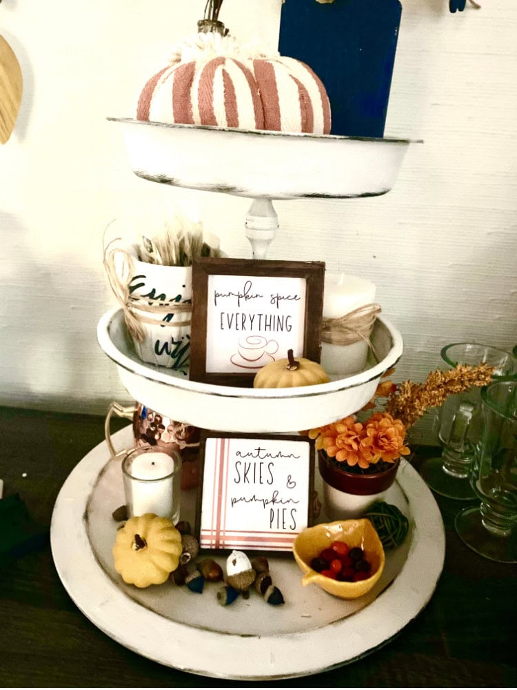 Delicious pumpkin-themed fall display featuring pumpkin-shaped pies, autumnal decorations, and cozy seasonal accents perfect for Thanksgiving or autumn celebrations.