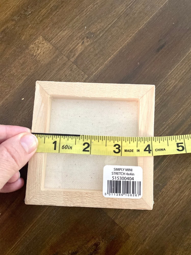Small wooden shadow box frame measuring approximately 4 inches by 4 inches, perfect for home decor or DIY projects.