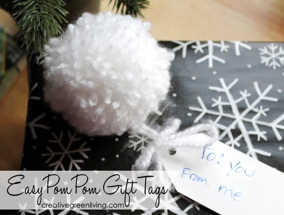Soft white pom-pom gift tag with handwritten "To: You From: Me" on a festive holiday background, ideal for Christmas gift wrapping and personalized presents.