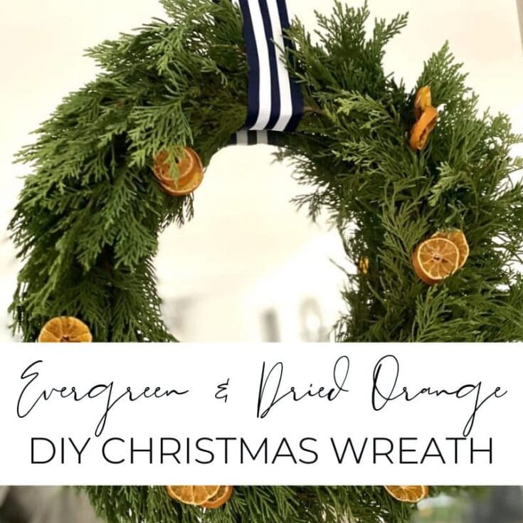 Green and dried orange DIY Christmas wreath made with evergreen foliage and dried orange slices, perfect for holiday decor and festive home decoration.