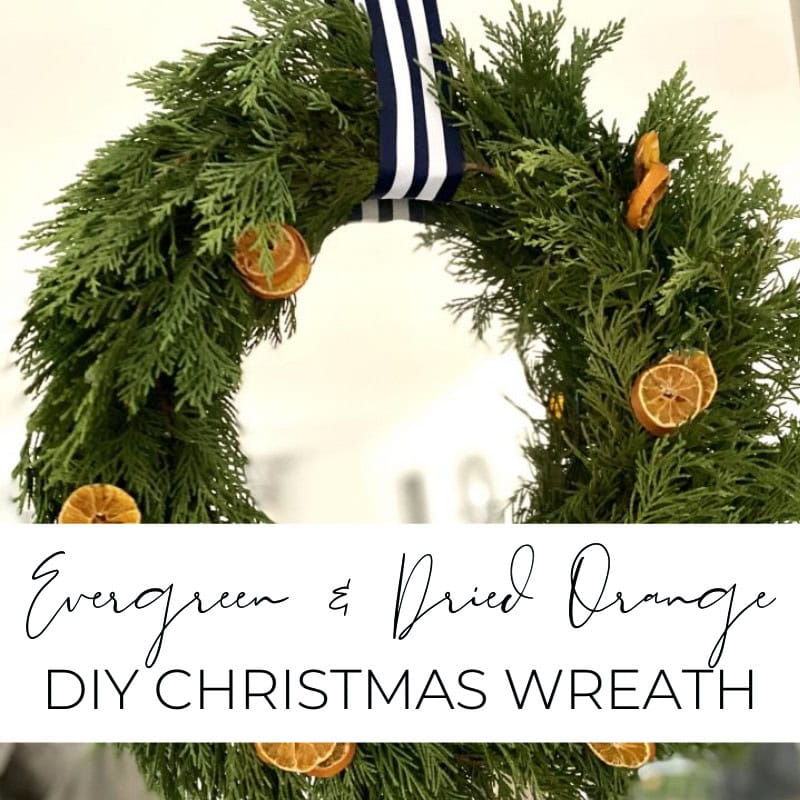 Green and dried orange DIY Christmas wreath made with evergreen foliage and dried orange slices, perfect for holiday decor and festive home decoration.