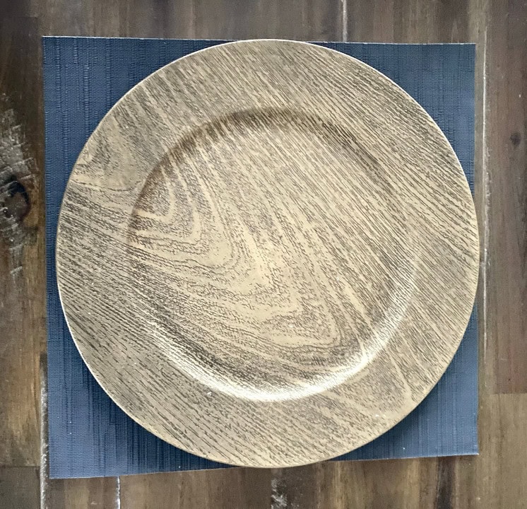 Handcrafted wooden plate with natural grain for rustic home decor and table settings. Unique, eco-friendly dining piece from A Hundred Affections.