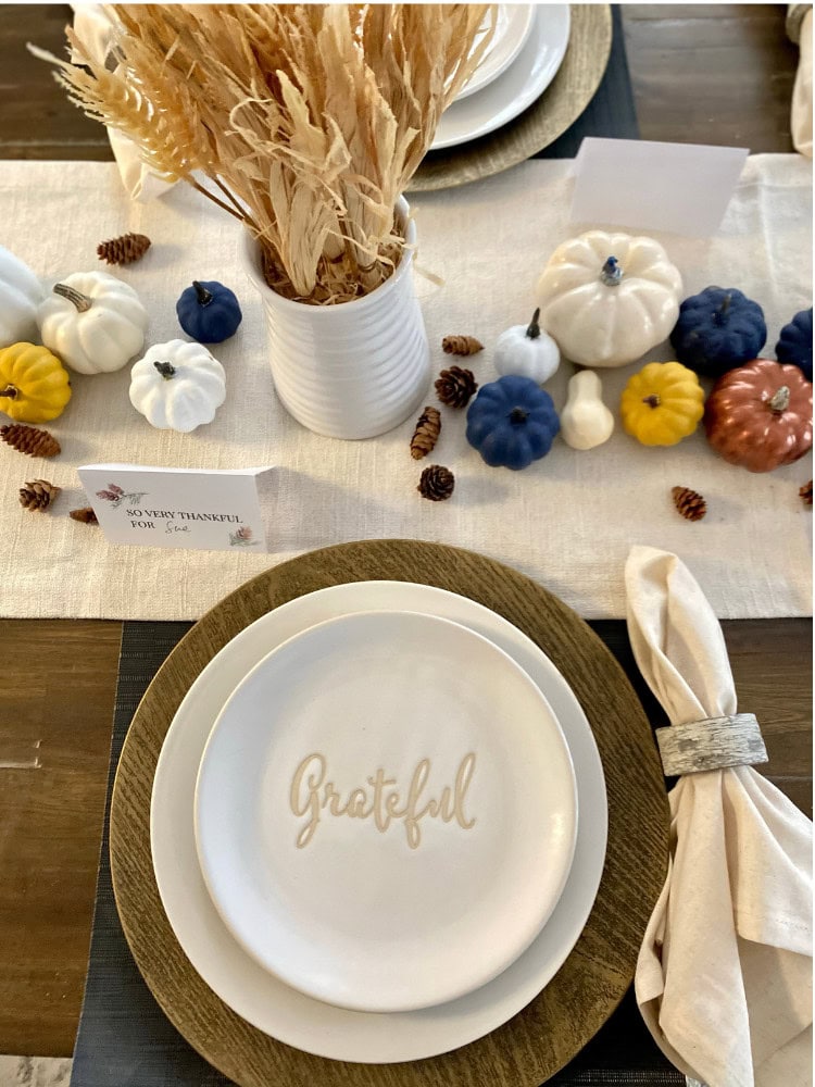 Pure white pumpkins and autumn-themed accents for a cozy fall table centerpiece at A Hundred Affections.