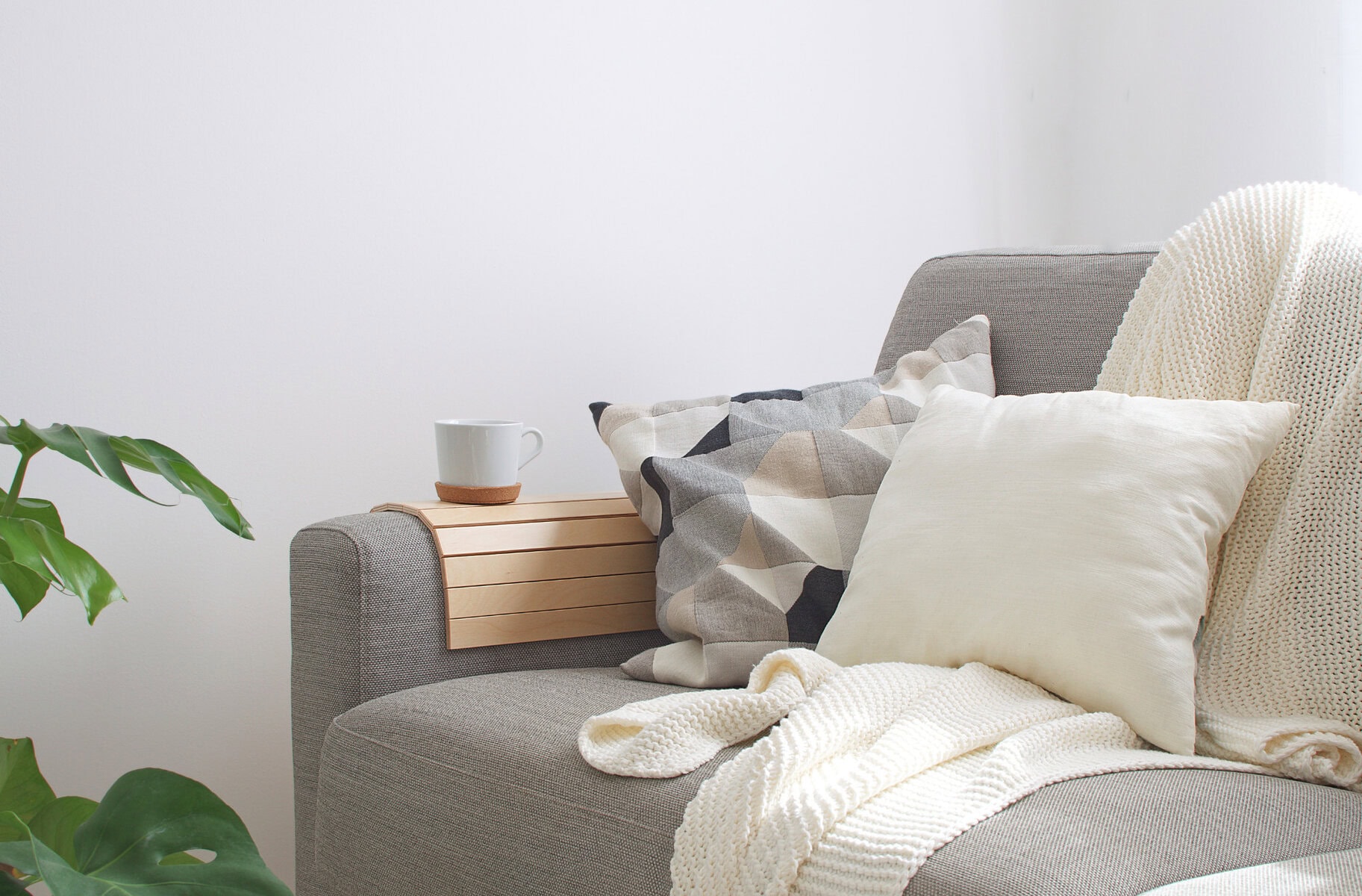 blankets and pillows on couch for cozy family room