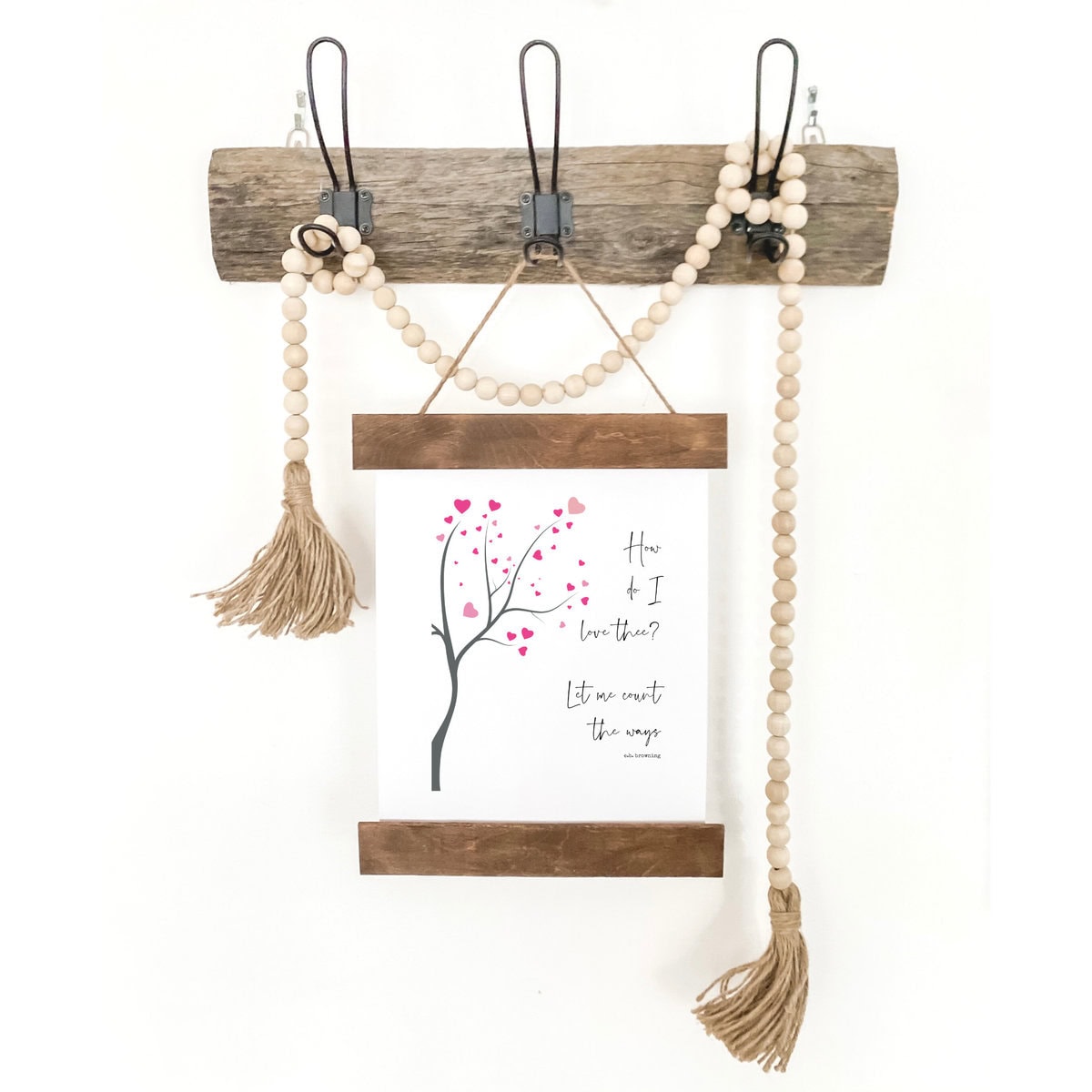 Beaded jewelry display with a hanging card featuring a romantic tree illustration and heartfelt quote, on a rustic wooden wall hook, perfect for love and gift decor.