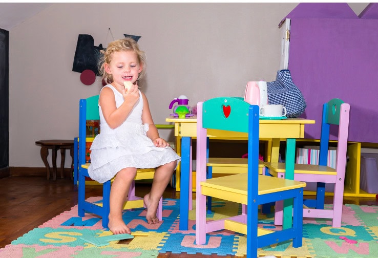Colorful children’s playroom with pastel furniture, playful decor, and a cheerful atmosphere for kids' activities and creativity.