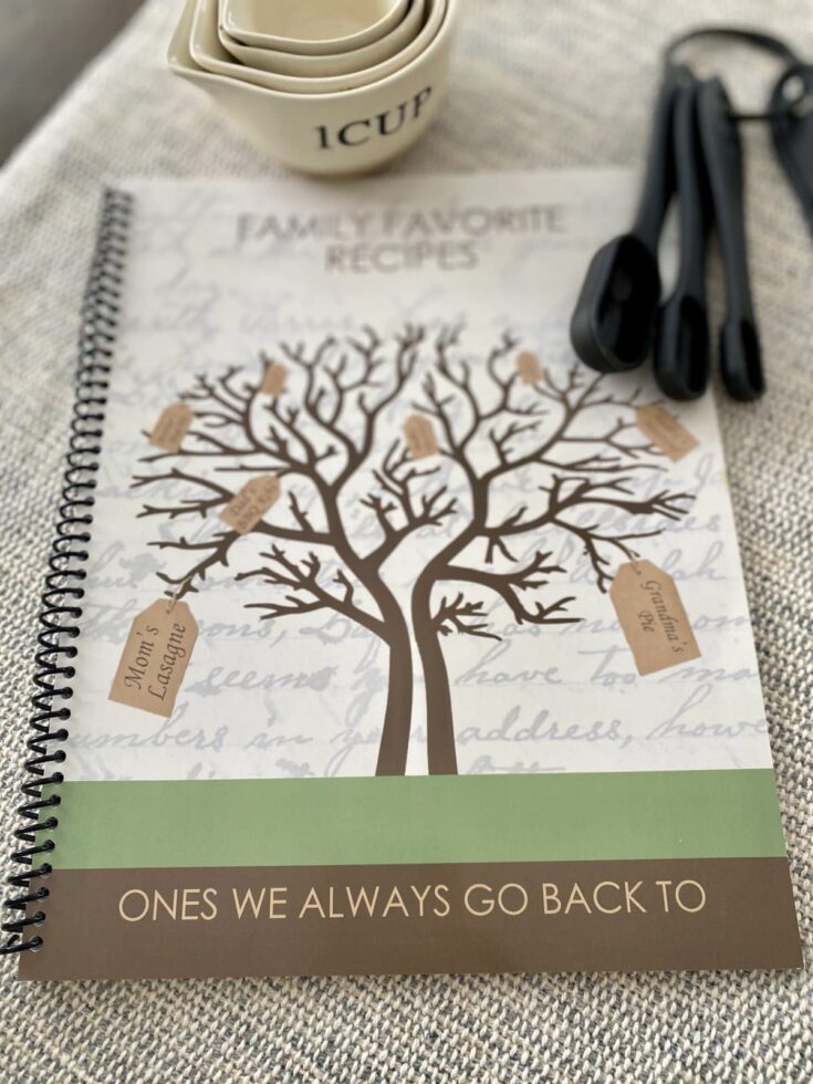 Personalized family recipe book with family tree design, keepsake tags, and motivational quote, perfect for capturing and preserving beloved family recipes and memories.