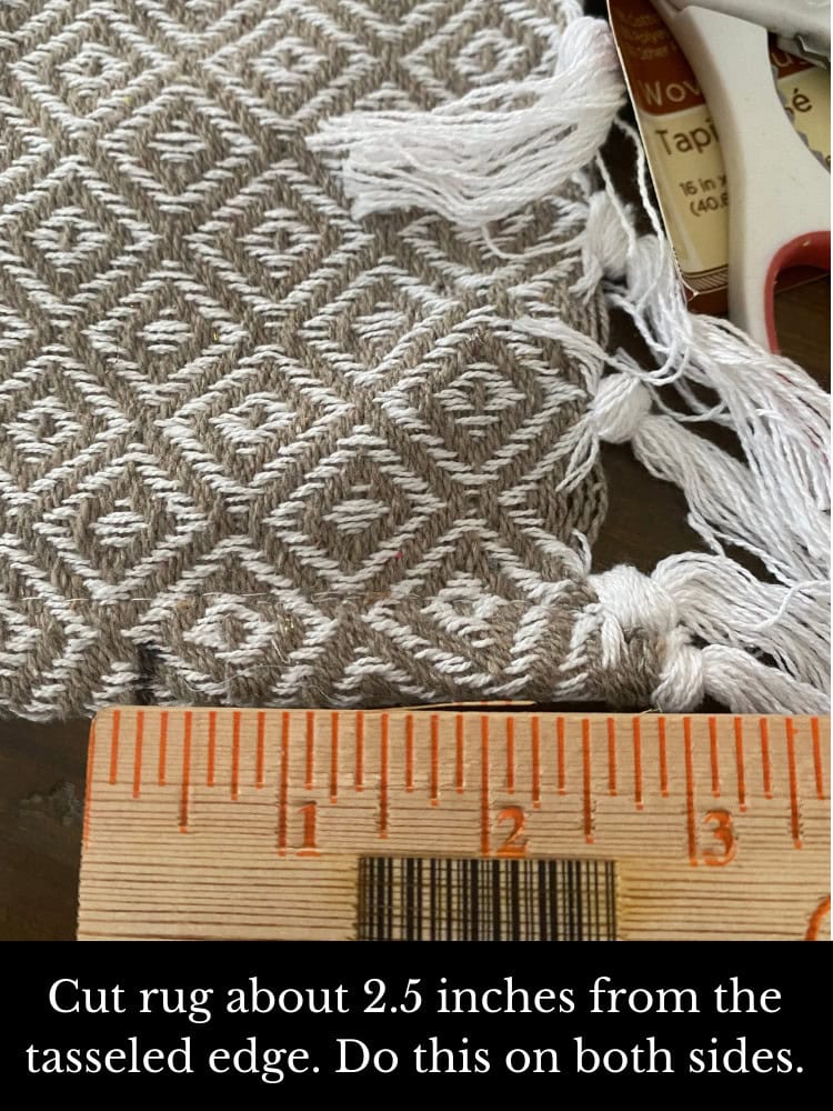 Intricate geometric patterned tassel edge rug, measuring approximately 2.5 inches from tasselled edge, ideal for home decor, handmade textile, woven craft, boho style accent piece.