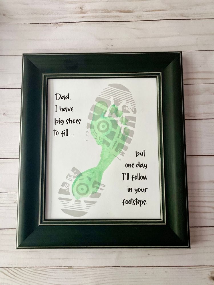 Child painted footprint inside bootprint for Father's Day gift printable