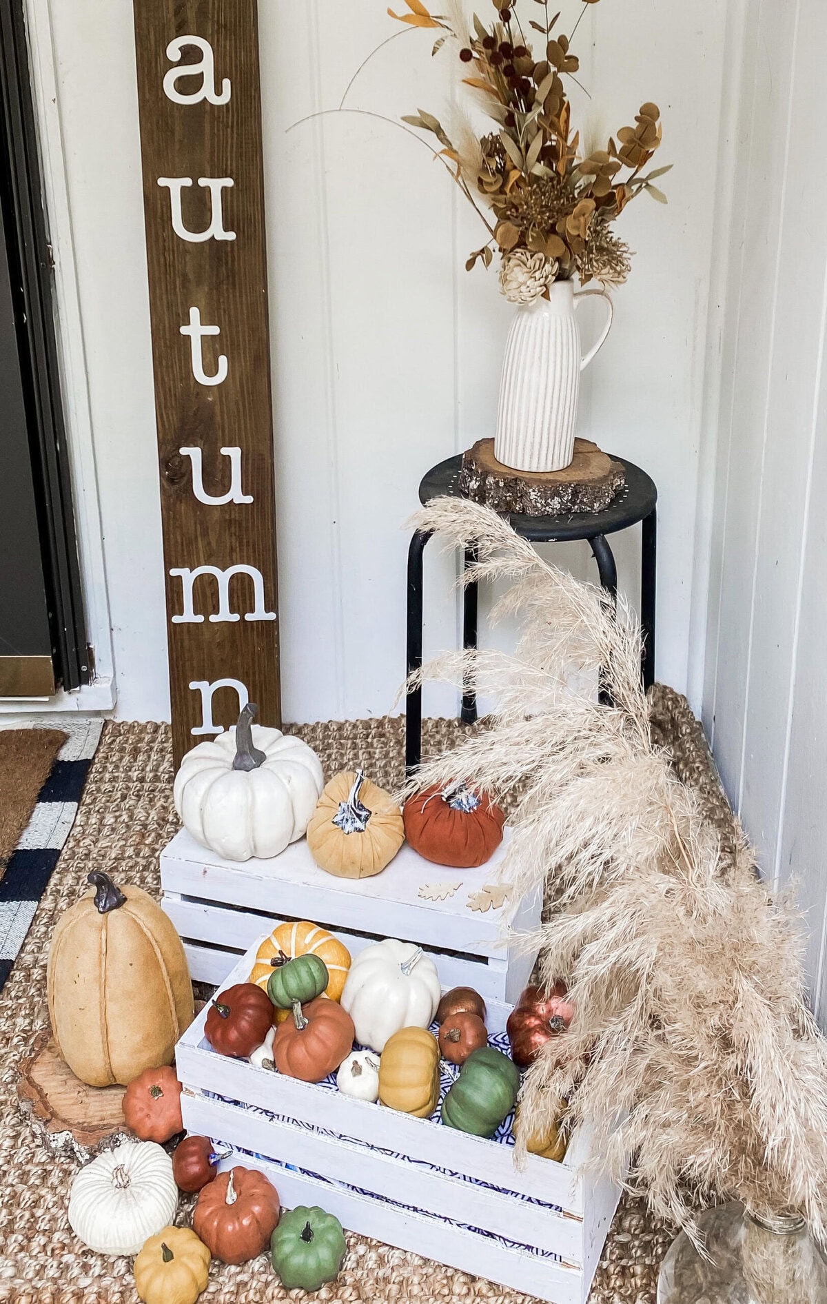 Pumpkin fall decor with neutral tones, dried flowers, and wooden accents for autumn seasonal decoration, cozy farmhouse style, and thanksgiving centerpiece.