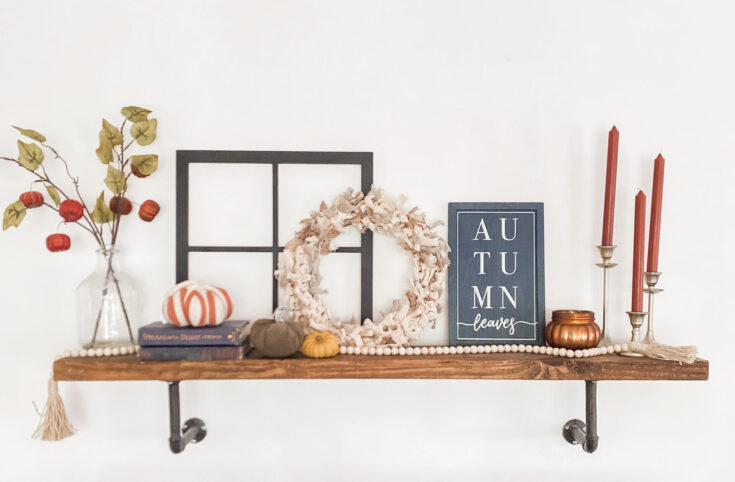 Rustic entryway decor with vintage wooden bench, cozy pillows, dried floral arrangement, and bohemian accessories, perfect for creating a warm and inviting farmhouse style.