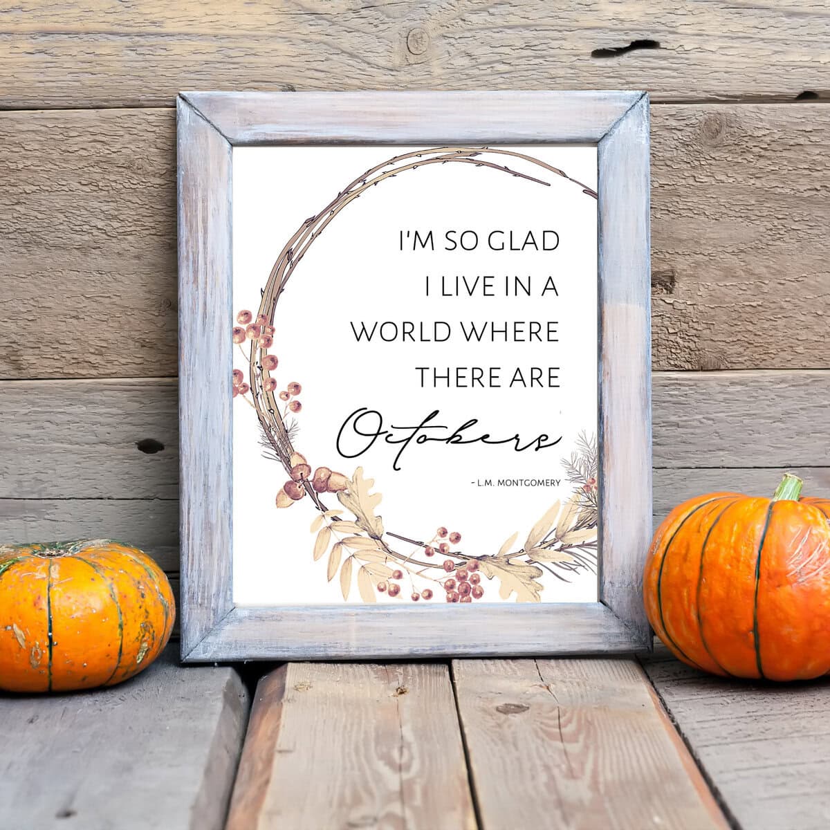 Peaceful autumn-themed decor with a framed quote surrounded by fall foliage and pumpkins. Perfect for seasonal home accents and cozy fall atmosphere.