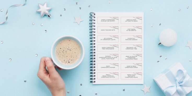 Festive holiday planning with a Christmas to-do list, a cup of coffee, and holiday decorations on a light blue background for A Hundred Affections.