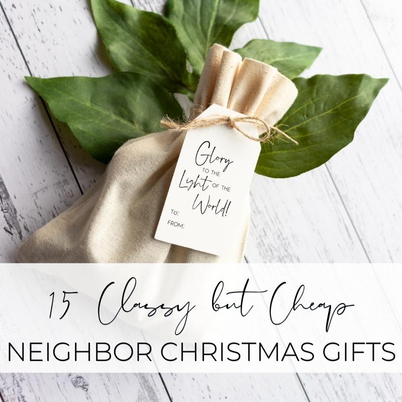 Simple holiday gift wrap with green leaves and a "Glory to the Light of the World" tag, perfect for affordable and stylish neighbor Christmas gifts.