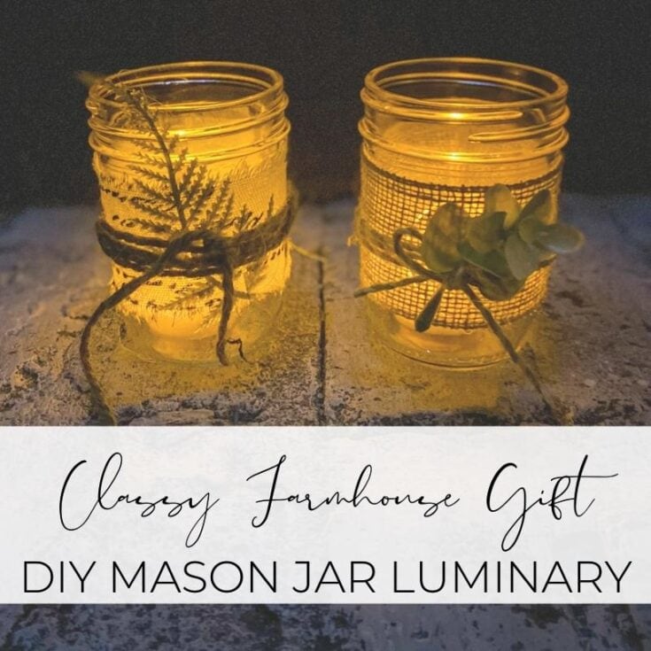 Rustic mason jar luminary with fairy lights, decorative twine, and dried foliage for farmhouse or vintage home decor, perfect as a DIY gift or cozy lighting option.
