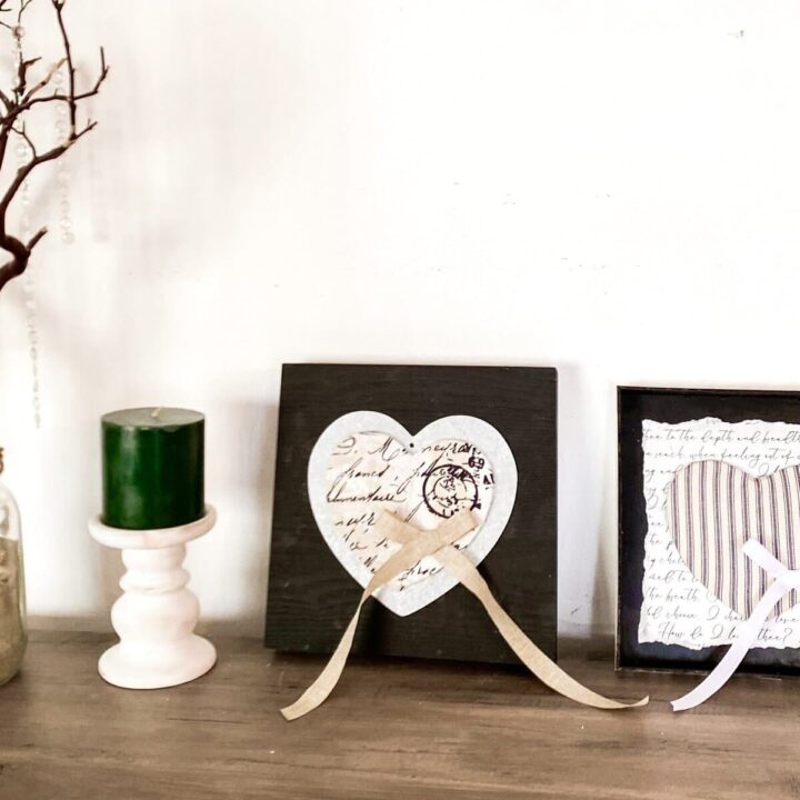 Aromatherapy and decor arrangements featuring heart-themed crafts and vintage-style frames for romantic home decor.