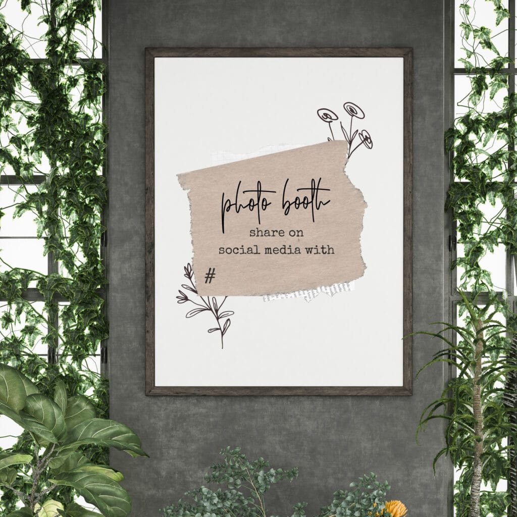 Handmade sign for a photo booth area, featuring a beige torn paper design with floral accents, suitable for social media sharing at events or parties.