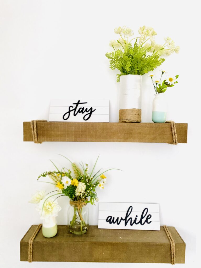 stay awhile signs on spring floating shelves