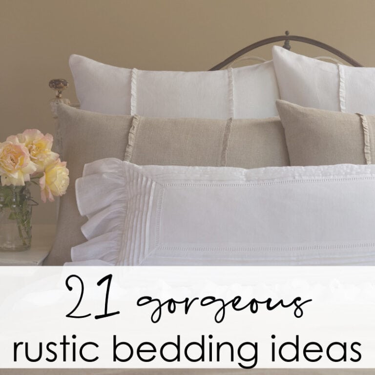 Luxurious white and beige linen pillows on a cozy bed with floral accents, showcasing rustic charm. Perfect for creating a warm, inviting bedroom with vintage-inspired bedding ideas from A Hundred Affections.